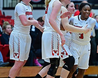 YOUNGSTOWN, OHIO - FEBRUARY 15, 2018: Youngstown State players including Sarah Cash, Anne Secrest, Nikki Arbanas and McKenah Peters celebrate with Indiya Benjamin, right, after Youngstown State defeated Milwaukee 86-85 in overtime, Thursday night. DAVID DERMER | THE VINDICATOR