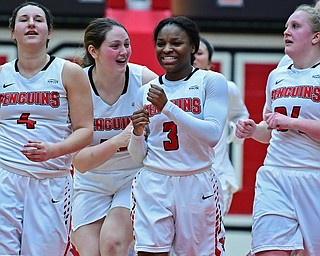 YOUNGSTOWN, OHIO - FEBRUARY 15, 2018: Youngstown State's Mary Dunn celebrates with Indiya Benjamin after Youngstown State defeated Milwaukee 86-85 in overtime, Thursday night. DAVID DERMER | THE VINDICATOR..Youngstown State's Nikki Arbanas and McKenah Peters pictured.