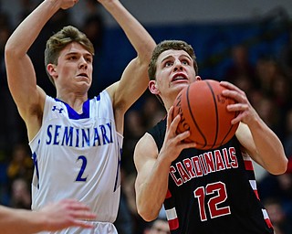 POLAND, OHIO - FEBRUARY 16, 2018: Canfield's Ethan Kalina goes to the basket against Poland's Mike Diaz during the second half of their game on Friday night at Poland Seminary High School. DAVID DERMER | THE VINDICATOR