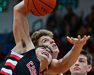 POLAND, OHIO - FEBRUARY 16, 2018: Canfield's Ben Shapiro grabs a rebound away from Poland's Mike Diaz during the second half of their game on Friday night at Poland Seminary High School. DAVID DERMER | THE VINDICATOR