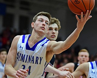 POLAND, OHIO - FEBRUARY 16, 2018: Poland's Billy Orr grabs a rebound away from Canfield's Zach Tinkey during the second half of their game on Friday night at Poland Seminary High School. DAVID DERMER | THE VINDICATOR