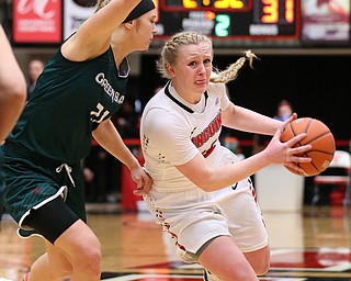YOUNGSTOWN, OHIO - FEBRUARY 17, 2018: YSU Penguins' McKenah Peters (34) drives to the hoop against Green Bay Phoenix's Jessica Linstrom (24) during the 2nd qtr. at Beeghly Center, YSU, Youngstown, OH.  MICHAEL G. TAYLOR | THE VINDICATOR