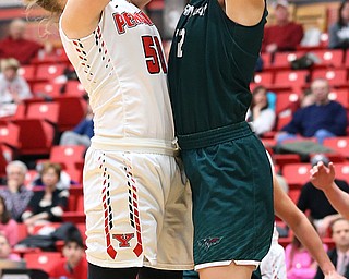 YOUNGSTOWN, OHIO - FEBRUARY 17, 2018: YSU Penguins' Anne Secrest (50) puts up a shot against Green Bay Phoenix's Mackensie Wolf (42) during the 4th qtr. at Beeghly Center, YSU, Youngstown, OH.  MICHAEL G. TAYLOR | THE VINDICATOR