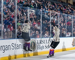 Scott R. Galvin | The Vindicator.Youngstown Phantoms right wing Eric Esposito (7) jumps against the boards as he celebrates his second period goal against the Waterloo Black Hawks at the Covelli Centre on Saturday, February 17, 2018.