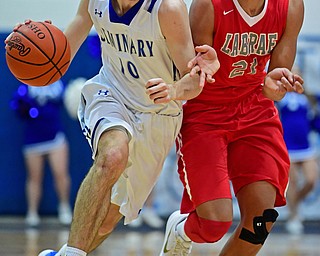 POLAND, OHIO - FEBRUARY 20, 2018: Poland's Dan Kramer drives on LaBrae's Tyler Stephens during the first half of their game on Tuesday night at Poland High School. DAVID DERMER | THE VINDICATOR