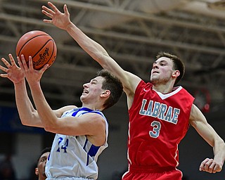 POLAND, OHIO - FEBRUARY 20, 2018: Poland's Billy Orr goes to the basket against LaBrae's Aaron Iler during the first half of their game on Tuesday night at Poland High School. DAVID DERMER | THE VINDICATOR