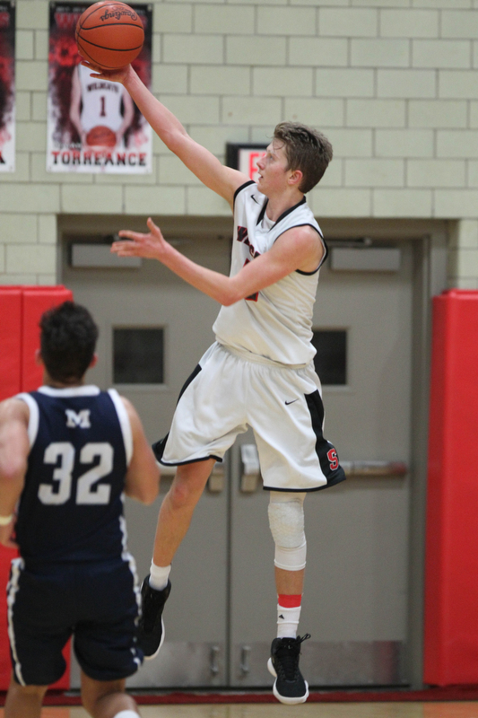 Carson Ryan (5) of Struthers goes up for an open layup during the second half of Tuesday nights matchup against McDonald at Struthers Field House.  Dustin Livesay  |  The Vindicator  2/20/18 Struthers