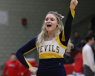 McDonald junior cheerleader Mckenzie Kilbourne performs a cheer during the first half of Tuesday nights matchup at Struthers Field House.  Dustin Livesay  |  The Vindicator  2/20/18 Struthers