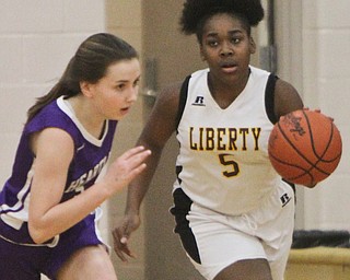 William D Lewis The Vindicator  Liberty's Delia Watson(5) drives around Heartland's Jeanna Morgan (5) during 2-21-18 action at Liberty.