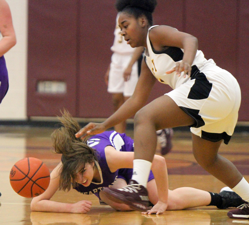 William D Lewis The Vindicator  Liberty's Delia Watson(5) drives around Heartland's JJulia Reynolds(32) during 2-21-18 action at Liberty.