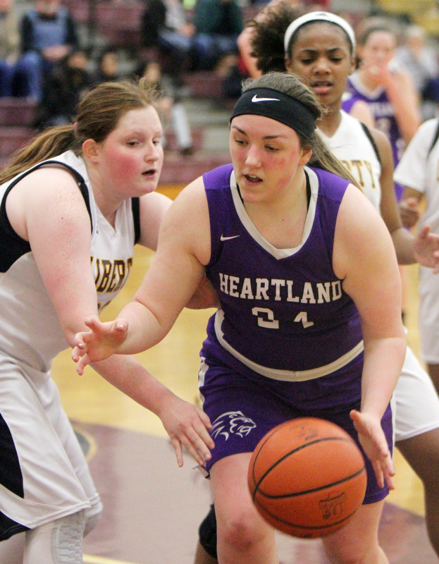 William D Lewis The Vindicator  Liberty's Melanie Bardel(33) defends as )  Heartland's Jana Croyts(24) dribbles during 2-21-18 action at Liberty.