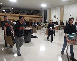 Neighbors | Zack Shively.St. Christine School placed their classroom materials from the displaced classes in the gymnasium. The Cardinal Mooney and Ursuline students moved the materials into other rooms to get classes ready for school.