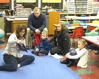 Neighbors | Zack Shively.Market Street Elementary had a Literacy Night at the school on Feb. 8. The event allowed parents and children to come to the school so that the parents gain a better perspective of their children's everyday experiences in their language arts class. Pictured, guest reader Alex George read to young students and their families.