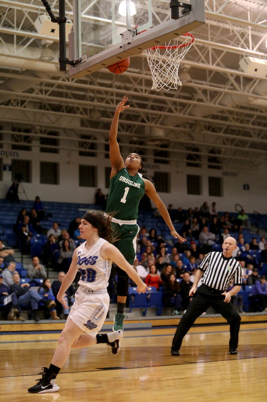 Ursuline's Dayshonette Harris (1) goes up for a layup over Poland guard Marlie McConnell (20) in the third quarter of an Division II sectional final high school basketball game, Thursday, Feb. 22, 2018, in Poland. Poland won 50-49...(Nikos Frazier | The Vindicator)