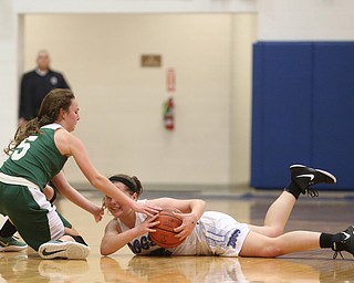 Poland guard Kat Partika (22) and Ursuline's Cara McNally (5) fight over a loose ball after Partika dove for itin the fourth quarter of an Division II sectional final high school basketball game, Thursday, Feb. 22, 2018, in Poland. Poland won 50-49...(Nikos Frazier | The Vindicator)
