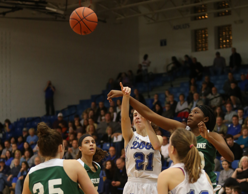 Ursuline's Anyah Curd (30) attempts to block Poland guard Jackie Grisdale (21)'s shot in the fourth quarter of an Division II sectional final high school basketball game, Thursday, Feb. 22, 2018, in Poland. Poland won 50-49...(Nikos Frazier | The Vindicator)