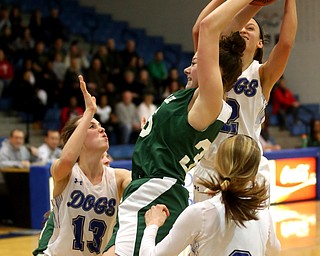 Poland guard Sarah Bury (2) grabs the rebound from Ursuline's Lindsay Bell (35) as Poland forward Maggie Sebest (13) and Poland guard Bella Gajdos (0) watch on in the fourth quarter of an Division II sectional final high school basketball game, Thursday, Feb. 22, 2018, in Poland. Poland won 50-49...(Nikos Frazier | The Vindicator)