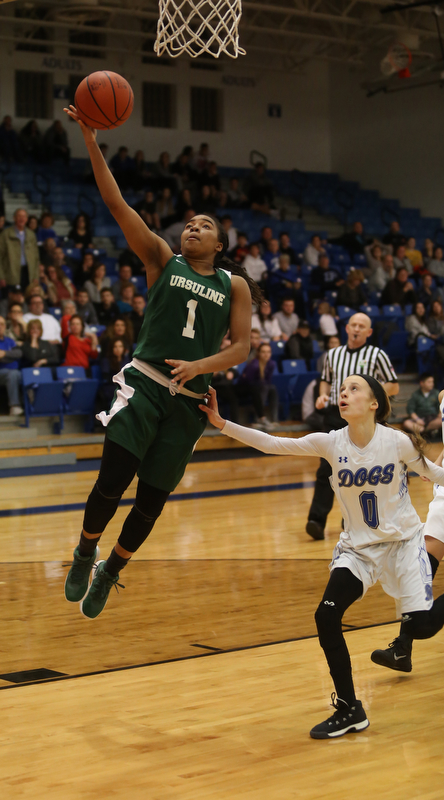 Ursuline's Dayshonette Harris (1) goes up for a layup past Poland guard Bella Gajdos (0) in overtime of an Division II sectional final high school basketball game, Thursday, Feb. 22, 2018, in Poland. Poland won 50-49...(Nikos Frazier | The Vindicator)