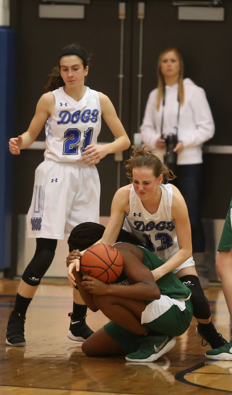 Poland forward Maggie Sebest (13) grabs the rebound from Ursuline's Anyah Curd (30) in overtime of an Division II sectional final high school basketball game, Thursday, Feb. 22, 2018, in Poland. Poland won 50-49...(Nikos Frazier | The Vindicator)