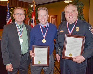 Scott Williams - The Vindicator - The Austintown Growth Foundation presented awards for the 2017 Hall Of Fame Class on Thursday February 22, 2018 at Rachel's Restaurant in Austintown.  From left to right: Kenneth P. Jakubec (Hall of Fame Inductee), Dr. Gregory Facemyer (Son of the late John R. Facemyer - Inductee), and Officer Jeffry M. Toth (Inductee).
