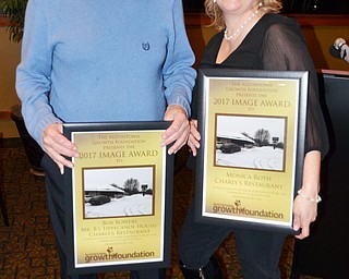 Scott Williams - The Vindicator - The Austintown Growth Foundation presented awards for the 2017 Hall Of Fame Class on Thursday February 22, 2018 at Rachel's Restaurant in Austintown.  From left to right - Bob Bowers (former owner of Charly's Restaurant - Image Award Inductee), Monica Roth (current owner of Charly's Restaurant - Image Award Inductee).