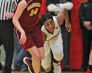 Khaylah Brown (1) of Struthers tries to get an angle on the ball to steal it from Mooney's Camden Hergenrother (14) during the second half of Thursday nights tournament game at the Struthers field house.  Dustin Livesay  |  The Vindicator  2/22/18 Struthers.