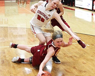 Kelly Williams (24) of Mooney dives underneath Renee Leonard (20) of Struthers to save the ball during the second half of Thursday nights tournament game at the Struthers field house.  Dustin Livesay  |  The Vindicator  2/22/18 Struthers.