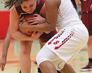 Mooney's Conchetti Rinaldi (42) tries to keep Khaylah Brown (1) of Struthers from stealing the ball during Thursday nights tournament game at the Struthers field house.  Dustin Livesay  |  The Vindicator  2/22/18 Struthers.