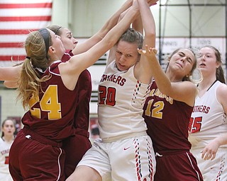 Renee Leonard (20) of Struthers fights for a rebound between Mooney's Kelly Williams (24) and Lexi Saunders (12) during Thursday nights tournament game at the Struthers field house.  Dustin Livesay  |  The Vindicator  2/22/18 Struthers.