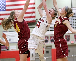 Alexis Bury (13) of Struthers gets double teamed by Mooney's Caitlin Perry (44) and Lauren Frommelt (15) during the first half of Thursday nights tournament game at the Struthers field house.  Dustin Livesay  |  The Vindicator  2/22/18 Struthers.