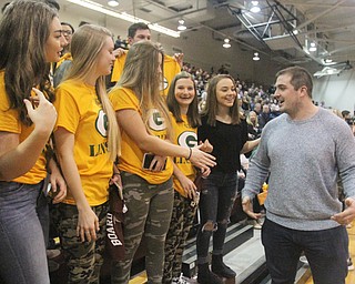 William D. Lewis The Vindicator   Corey Linsley greets students during 2-23-18 basketball game