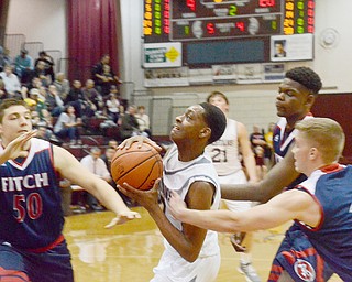 Scott Williams - The Vindicator - Boardman's Che Trevena (#13) tries to keep the ball away from Austintown Fitch's Tom Leskovac (#50), A.J. Green (#13), and Kole Klasic (#14) during the second quarter of their game on Friday February 23, 2018.