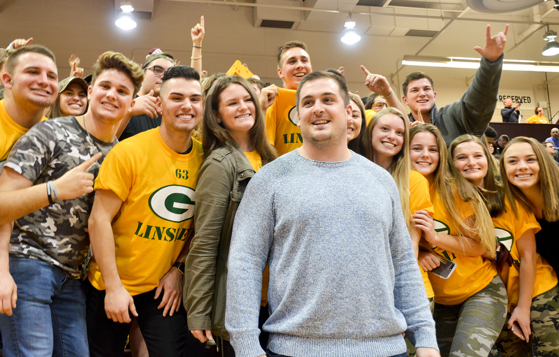 Scott Williams - The Vindicator - 2009 Boardman graduate and Green Bay Packers center Corey Linsley meets Boardman High School students at the Boardman vs Austintown Fitch basketball game on Friday February 23, 2018.