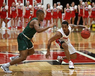 Youngstown State guard Jaylen Benton (4) fakes out Cleveland State guard Kasheem Thomas (1) during the first half of a NCAA Horizon League college basketball game, Saturday, Feb. 24, 2018, in Youngstown...(Nikos Frazier | The Vindicator)