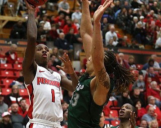 Youngstown State guard Braun Hartfield (1) goes up for a layup over Cleveland State forward Stefan Kenic (13) during the first half of a NCAA Horizon League college basketball game, Saturday, Feb. 24, 2018, in Youngstown...(Nikos Frazier | The Vindicator)