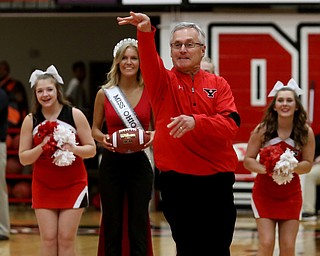 Youngstown State President Jim Tressel attempts a half court shot during the Burgan Real Estate, LTD. Mortgage Mania Challenge during the first half of a NCAA Horizon League college basketball game, Saturday, Feb. 24, 2018, in Youngstown...(Nikos Frazier | The Vindicator)