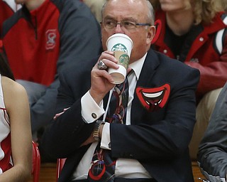 Columbiana head coach Ron Moschella watches the game while drinking from a Starbucks cup during the first half of an OHSAA Sectional Final, Saturday, Feb. 24, 2018, in Columbiana...(Nikos Frazier | The Vindicator)