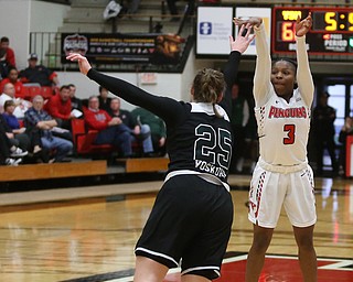 Youngstown State guard Indiya Benjamin (3) shoots for three over Cleveland State forward Olivia Voskuhl (25) during the second half of a NCAA Horizon League college basketball game, Saturday, Feb. 24, 2018, in Youngstown...(Nikos Frazier | The Vindicator)
