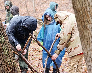 Members of Troop 9055 of Youngstown work together to build a tool rack during the Klondike Gold Rush at Camp Stambaugh on Saturday morning.  Dustin Livesay  |   The Vindicator  2/24/18  Camp Stambaugh