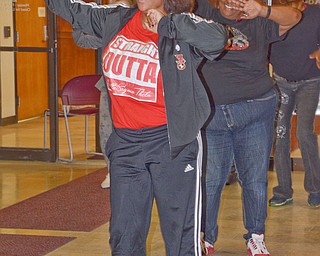 From left to right, Tiffany Patterson, Crystal Davis, and Jessica Williamson get moving at a Zumba event sponsored by Mercy Health at the Delta Sigma Theta Sorority Health Symposium held at the Youngstown Metropolitan Housing Authority's Amedia Plaza on Saturday February 24, 2018.

Scott Williams - The Vindicator