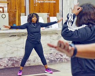 Zumba instructor Kelley Frazier from Mercy Health gets attendees of the Delta Sigma Theta Sorority Health Symposium moving at the Youngstown Metropolitan Housing Authority's Amedia Plaza on Saturday February 24, 2018. 

Scott Williams - The Vindicator