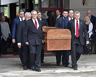 Pall bearers carry the body of Rev. Billy Graham before it leaves the Billy Graham Training Center at the Cove on Saturday, Feb. 24, 2018 in Asheville, N.C. Graham's body will be brought to his hometown of Charlotte on Saturday, Feb. 24, as part of a procession expected to draw crowds of well-wishers. (AP Photo/Kathy Kmonicek, Pool)