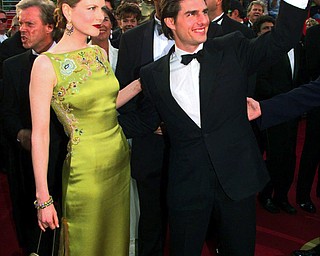 FILE - In this March 24, 1997 file photo, Tom Cruise and Nicole Kidman arrive for the 69th Annual Academy Awards in Los Angeles. Kidman wore an  embellished chartreuse Dior dress by John Galliano. (AP Photo/Chris Pizzello, File)