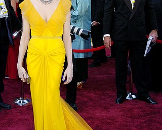 FILE - In this March 5, 2006 file photo, Michelle Williams, nominated for an Oscar for best actress in a supporting role for her work in "Brokeback Mountain," arrives for the 78th Academy Awards in Los Angeles. Williams wore a buttercup yellow gown by Vera Wang. (AP Photo/Chris Pizzello, File)