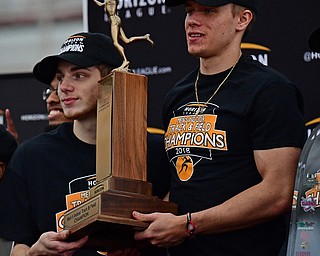YOUNGSTOWN, OHIO - FEBRUARY 25, 2018: Youngstown State's Chad Zallow, right, and Brendon Lucas, left, hold the Horizon League Indoor Track Championship trophy after the Horizon League indoor championship track meet, Sunday afternoon at the Watts Indoor Facility. DAVID DERMER | THE VINDICATOR