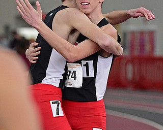 YOUNGSTOWN, OHIO - FEBRUARY 25, 2018: Youngstown State's Sean Peterson gets a hug from CJ Schumacher after winning the 800 meter during the Horizon League Indoor track Championship meet. DAVID DERMER | THE VINDICATOR