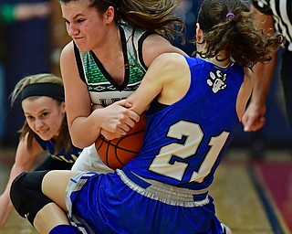 AUSTINTOWN, OHIO - FEBRUARY 26, 2018: West Branches's Peyton Alazaus and Poland's Jackie Grisdale wrestle for the loose ball near the sideline during the second half of their OHSAA Division 2 district tournament game on Monday night at Fitch High School. West Branch won 47-25. DAVID DERMER | THE VINDICATOR