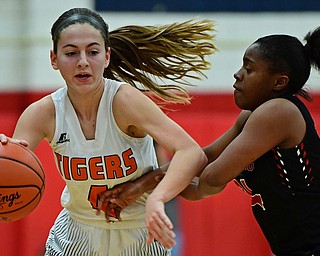 AUSTINTOWN, OHIO - FEBRUARY 26, 2018: Howland's Mackenzie Maze drives on Struthers' Keasia Chism during the first half of their OHSAA district tournament game at Fitch High School. Howland won 35-24. DAVID DERMER | THE VINDICATOR