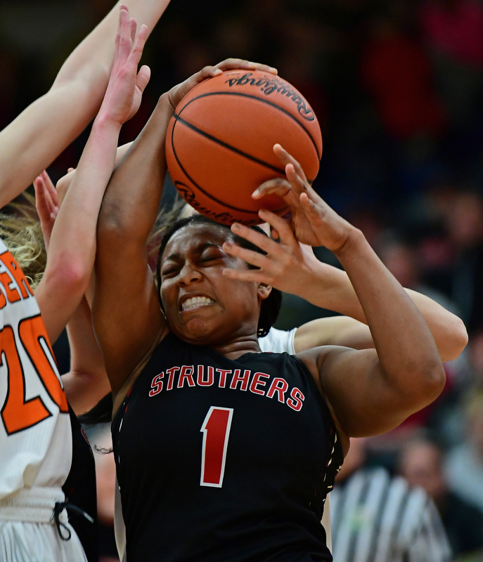 AUSTINTOWN, OHIO - FEBRUARY 26, 2018: Struthers' Khaylah Brown fights for the ball while being fouled by Howland's Kendyl Buckley during the first half of their OHSAA district tournament game at Fitch High School. Howland won 35-24. DAVID DERMER | THE VINDICATOR