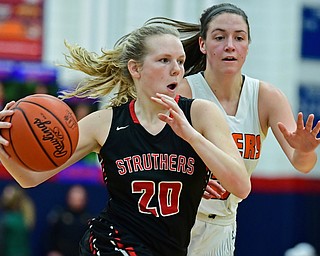 AUSTINTOWN, OHIO - FEBRUARY 26, 2018: Struthers' Renee Leonard drives on Howland's Kamryn Buckley during the first half of their OHSAA district tournament game at Fitch High School. Howland won 35-24. DAVID DERMER | THE VINDICATOR
